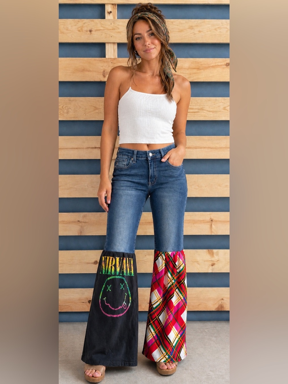 Upcycled NIRVANA T jeans with plaid flared panel.